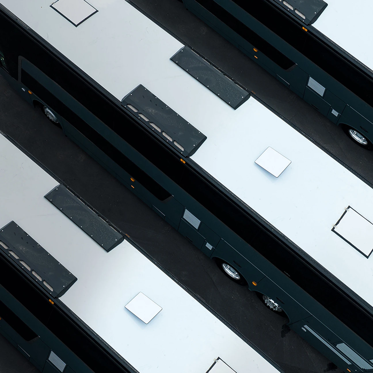 Aerial view of buses and Starlink dishes in motion