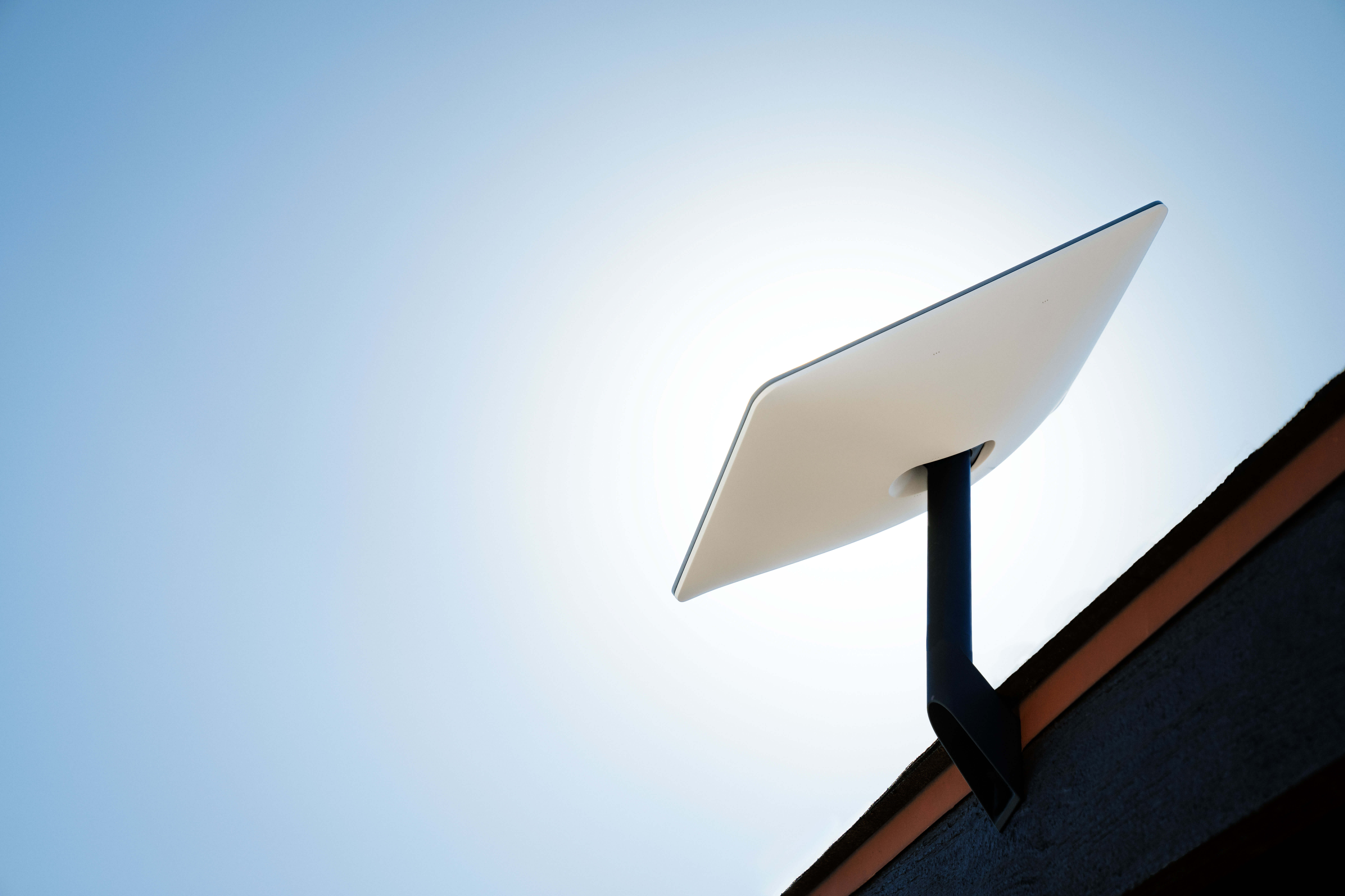 Crew member using Starlink Performance Kit on a vessel